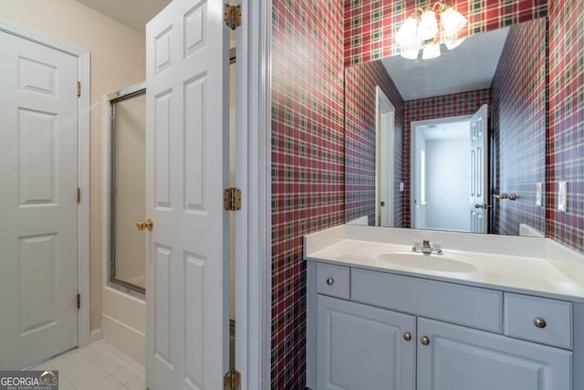 bathroom with vanity, enclosed tub / shower combo, and tile patterned floors