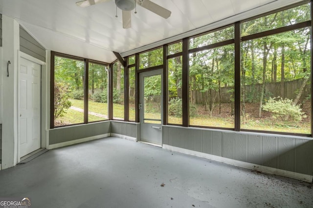 unfurnished sunroom with ceiling fan and plenty of natural light