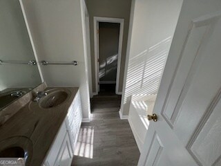 bathroom featuring vanity and hardwood / wood-style flooring