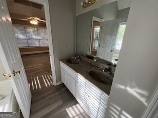 bathroom featuring vanity, hardwood / wood-style flooring, and ceiling fan