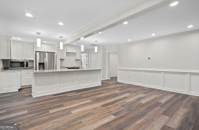 kitchen featuring hanging light fixtures, white cabinetry, dark wood-type flooring, and appliances with stainless steel finishes