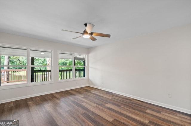 unfurnished room featuring dark hardwood / wood-style flooring and ceiling fan