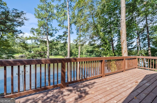 wooden deck featuring a water view