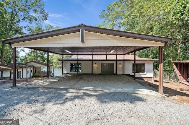 view of vehicle parking featuring a carport