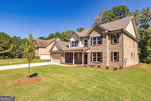 view of front of property featuring a front lawn and a garage