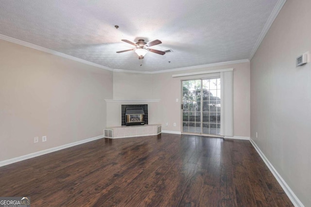 unfurnished living room featuring dark wood-type flooring, ceiling fan, a textured ceiling, and ornamental molding