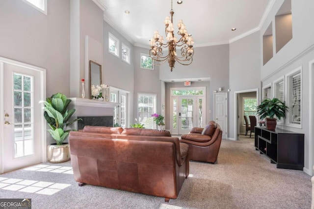 living room featuring light carpet, a healthy amount of sunlight, and a high ceiling