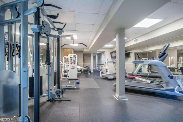 gym featuring a paneled ceiling