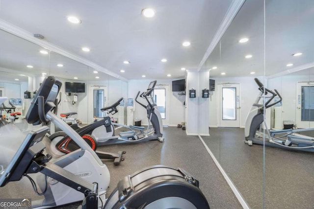 exercise room featuring crown molding