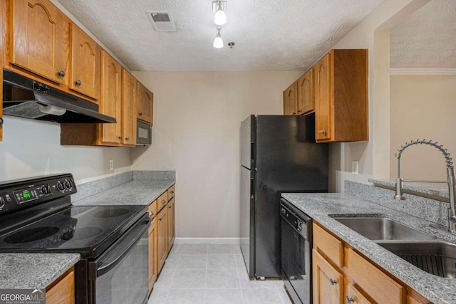 kitchen featuring light tile patterned floors, a textured ceiling, black appliances, crown molding, and sink