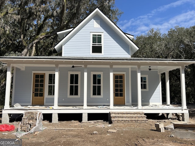 rear view of property featuring a porch and a ceiling fan