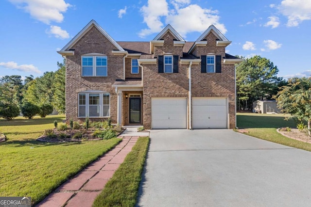 view of front of home featuring a garage and a front lawn