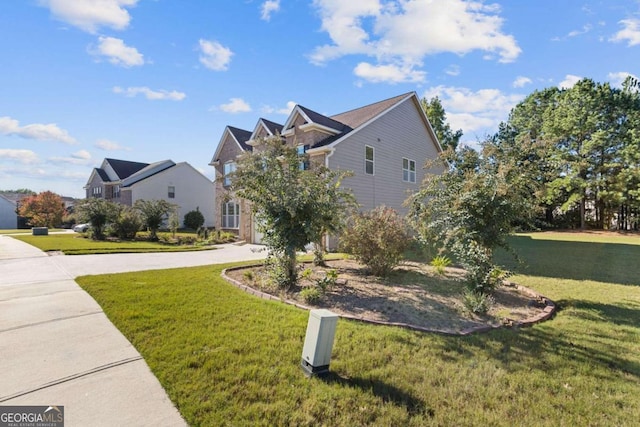 view of side of property featuring a lawn