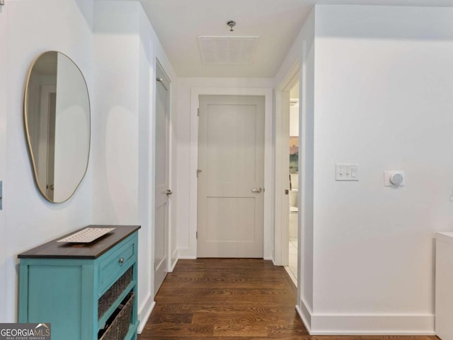 hallway with dark wood-type flooring