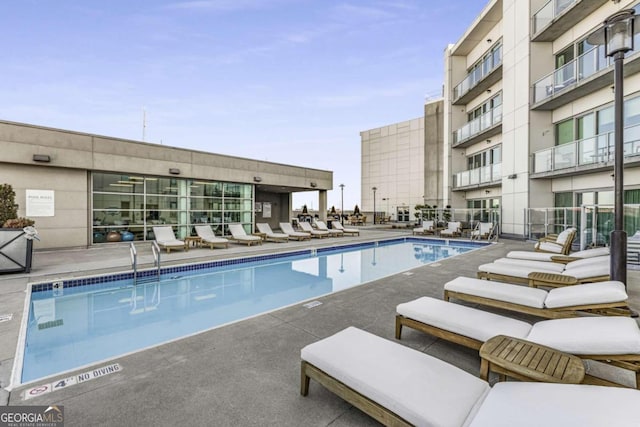 view of pool featuring a patio