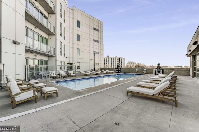 view of pool featuring a patio