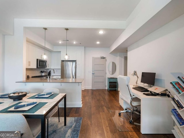 office space featuring sink and dark hardwood / wood-style floors