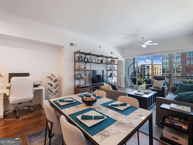 dining area featuring ceiling fan and dark hardwood / wood-style flooring