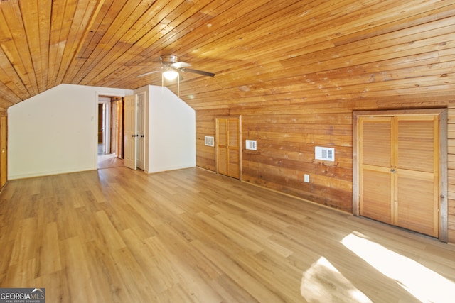 bonus room featuring light hardwood / wood-style flooring, wood walls, and wood ceiling