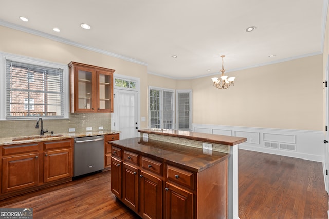 kitchen featuring sink, dishwasher, a center island, dark wood-type flooring, and a chandelier