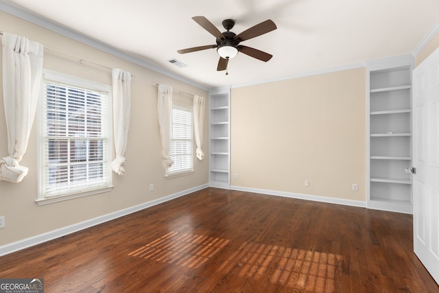 spare room with dark wood-type flooring, ceiling fan, and ornamental molding