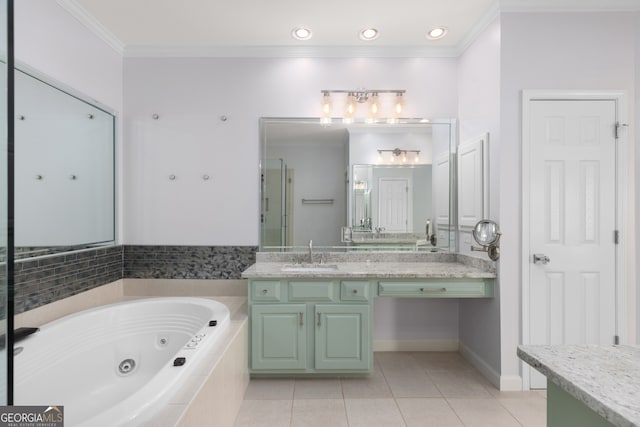 bathroom with vanity, ornamental molding, tiled tub, and tile patterned floors