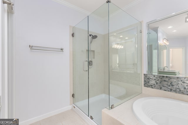 bathroom featuring ornamental molding, independent shower and bath, and tile patterned floors