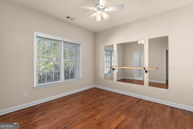 spare room featuring hardwood / wood-style flooring and ceiling fan