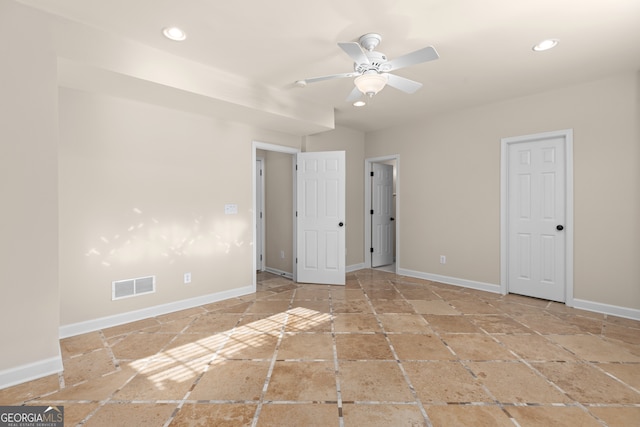 unfurnished bedroom featuring ceiling fan