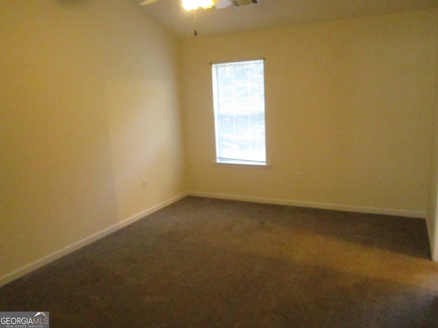 unfurnished room with carpet, vaulted ceiling, and ceiling fan