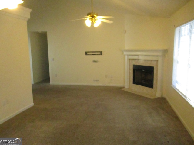 unfurnished living room featuring ceiling fan and carpet flooring