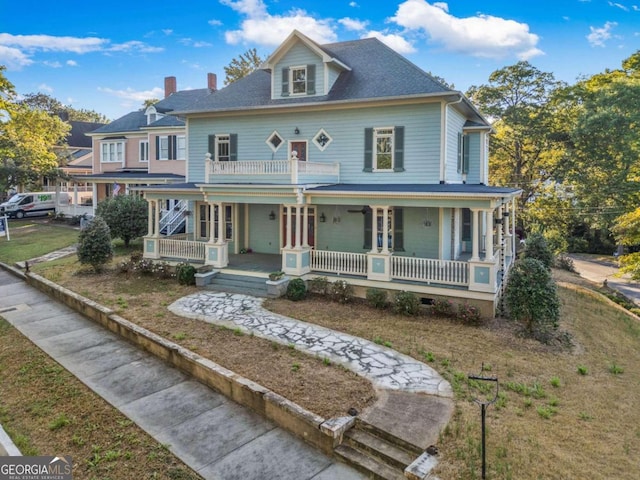 view of front facade with a porch and a front yard