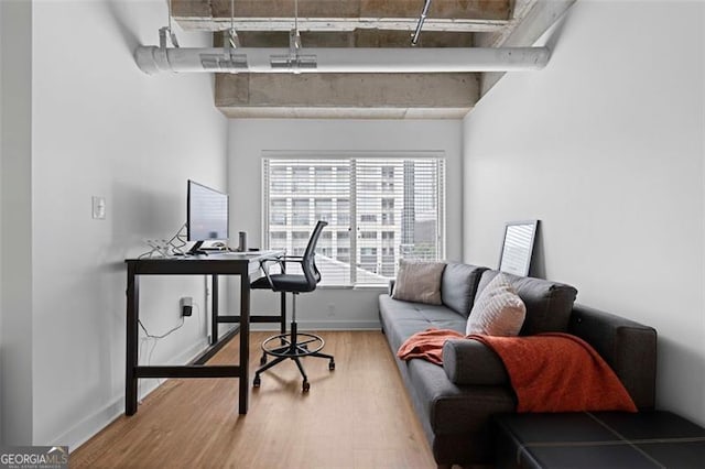 office space with wood-type flooring