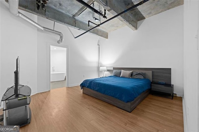 bedroom featuring wood-type flooring