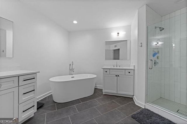 bathroom with vanity, shower with separate bathtub, and tile patterned flooring