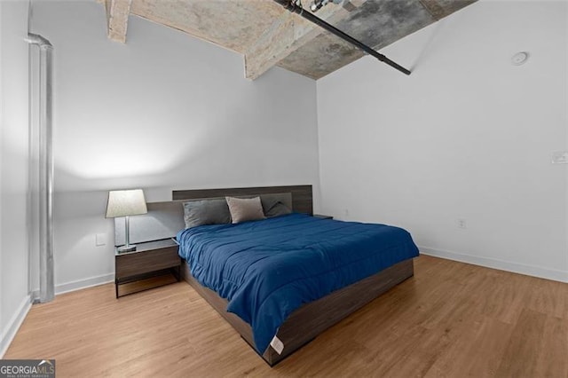 bedroom featuring wood-type flooring