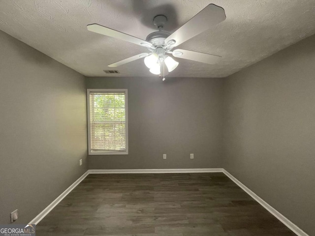 unfurnished room featuring dark hardwood / wood-style floors, a textured ceiling, and ceiling fan