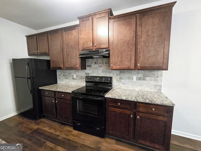 kitchen with light stone countertops, black appliances, backsplash, dark brown cabinetry, and dark hardwood / wood-style floors