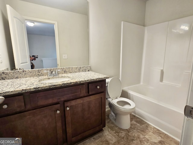 full bathroom with vanity, shower / washtub combination, and toilet