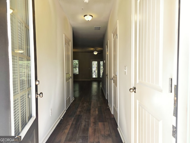 hallway featuring dark wood-type flooring