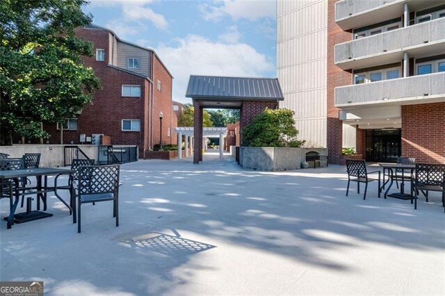 view of home's community featuring a patio area