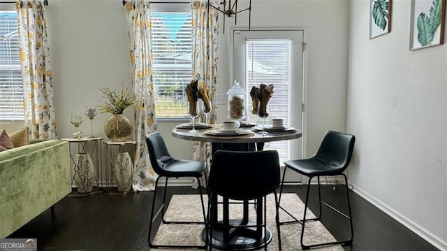 dining space with hardwood / wood-style floors