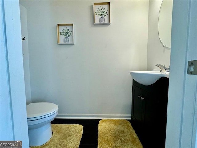 bathroom with vanity and toilet