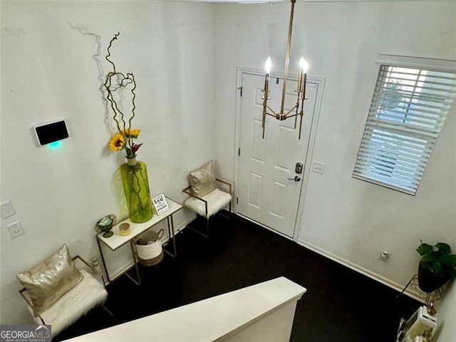 entrance foyer featuring an inviting chandelier