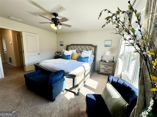 carpeted bedroom featuring ceiling fan