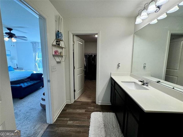 bathroom featuring vanity, hardwood / wood-style flooring, and ceiling fan