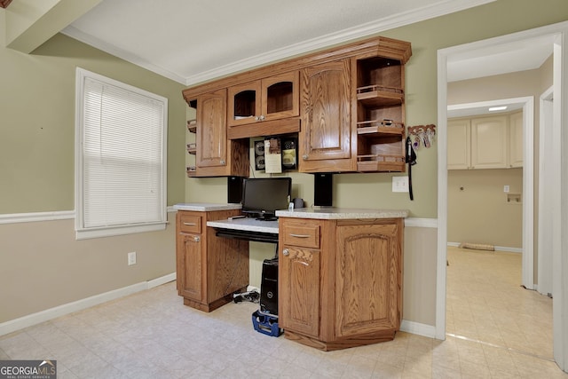 office area featuring built in desk and ornamental molding