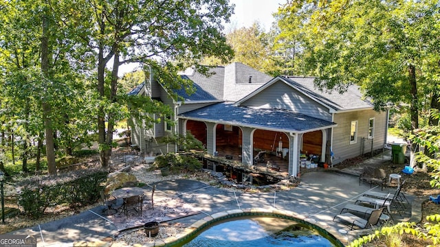 back of property featuring a patio area