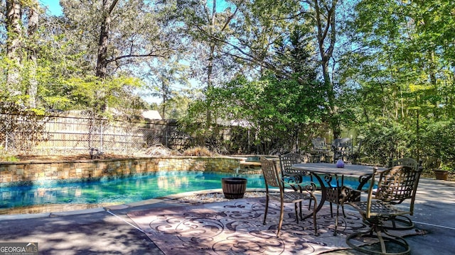 view of swimming pool with a patio