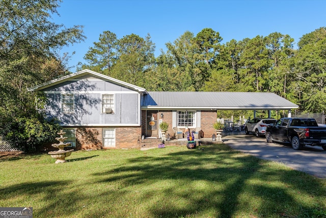 tri-level home with a front yard